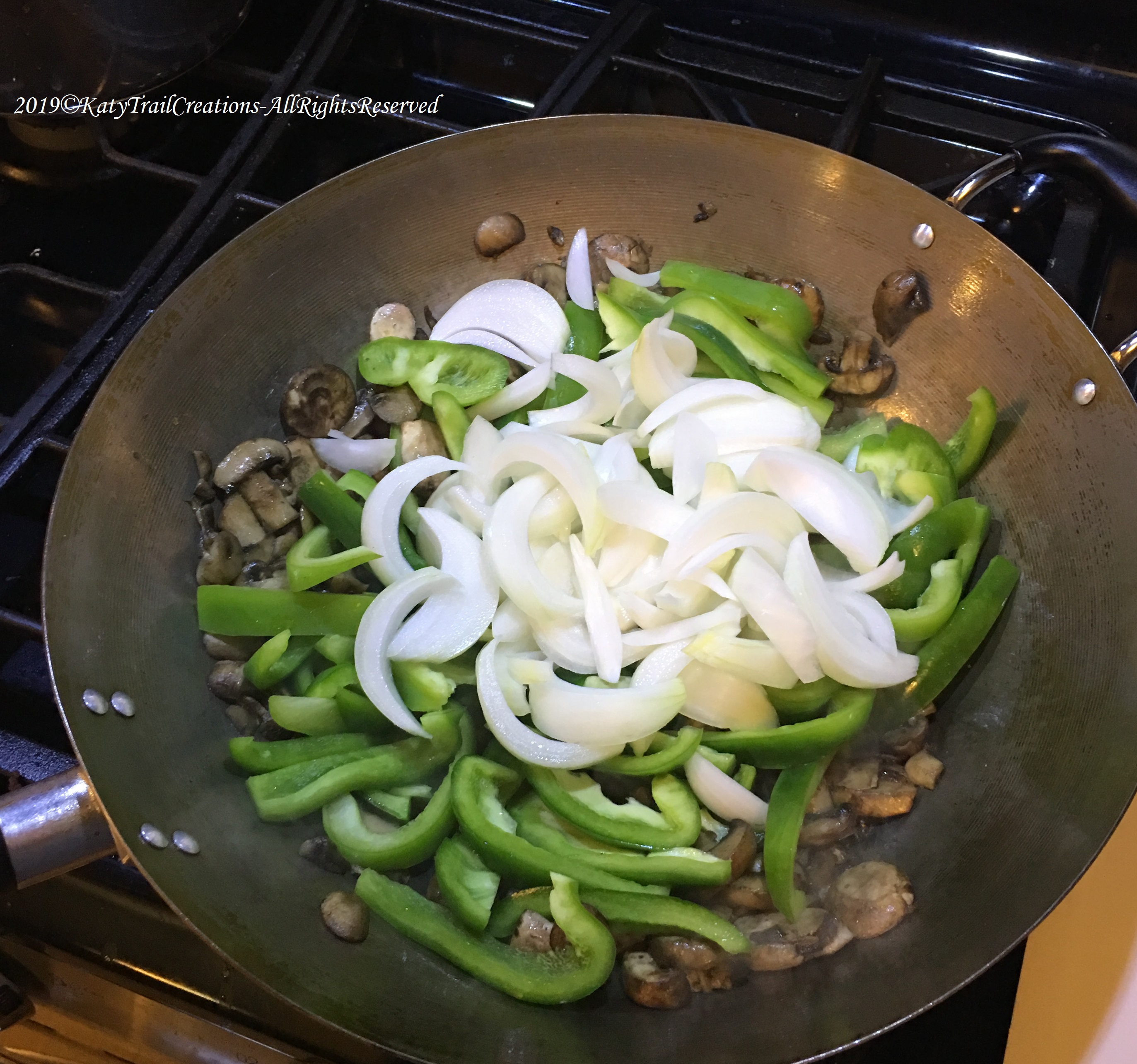 Adding the peppers and onions next.