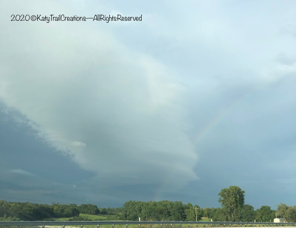 A Rainbow through the storm cloud