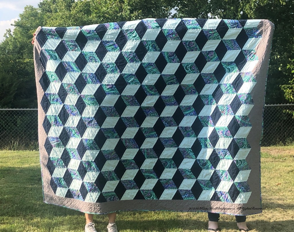 Tumbling Block Quilt with Kaffe Fassett Paisley Jungle as the feature fabric.